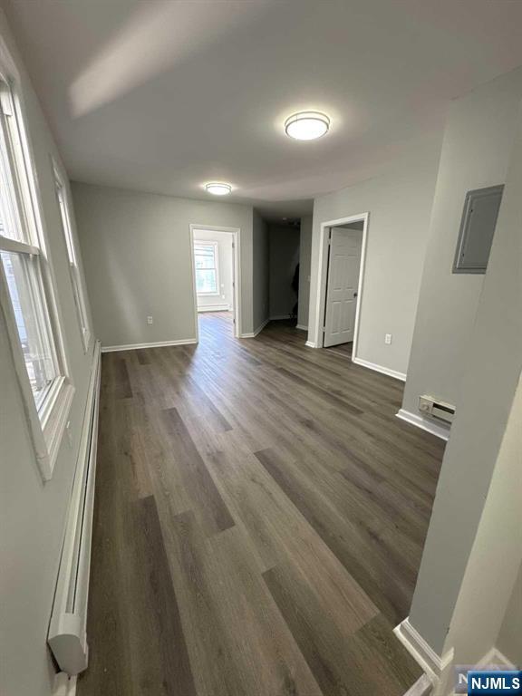108 Madison Street Paterson, NJ 07501 - Photo 9 of 15 a view of an empty room with wooden floor and a window