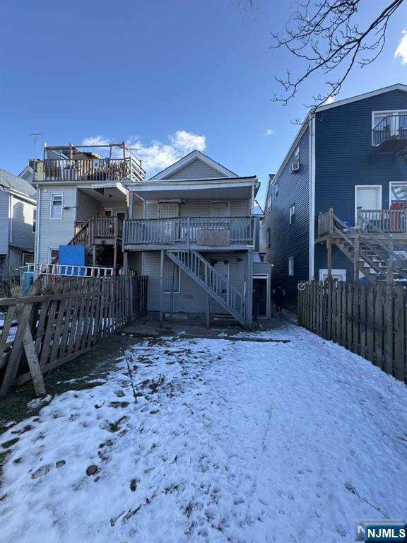 108 Madison Street Paterson, NJ 07501 - Photo 10 of 15 a view of a house with a wooden fence