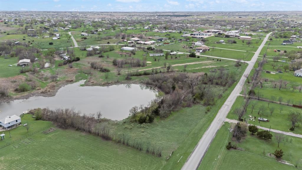9934 1st Street Joshua, TX 76058 - Photo 7 of 7 a view of a lake with green field