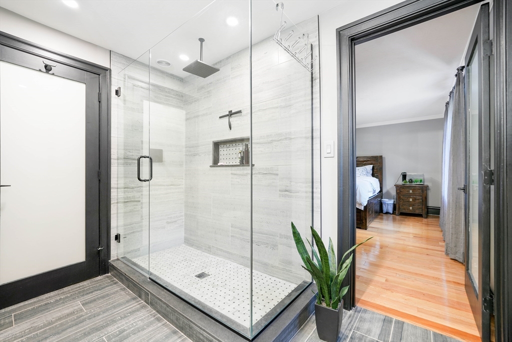 13 Gerrish Road Rochester, MA 02770 - Photo 18 of 30 a bathroom with a glass shower door and a sink