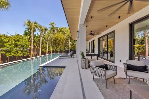 a view of a swimming pool with a deck