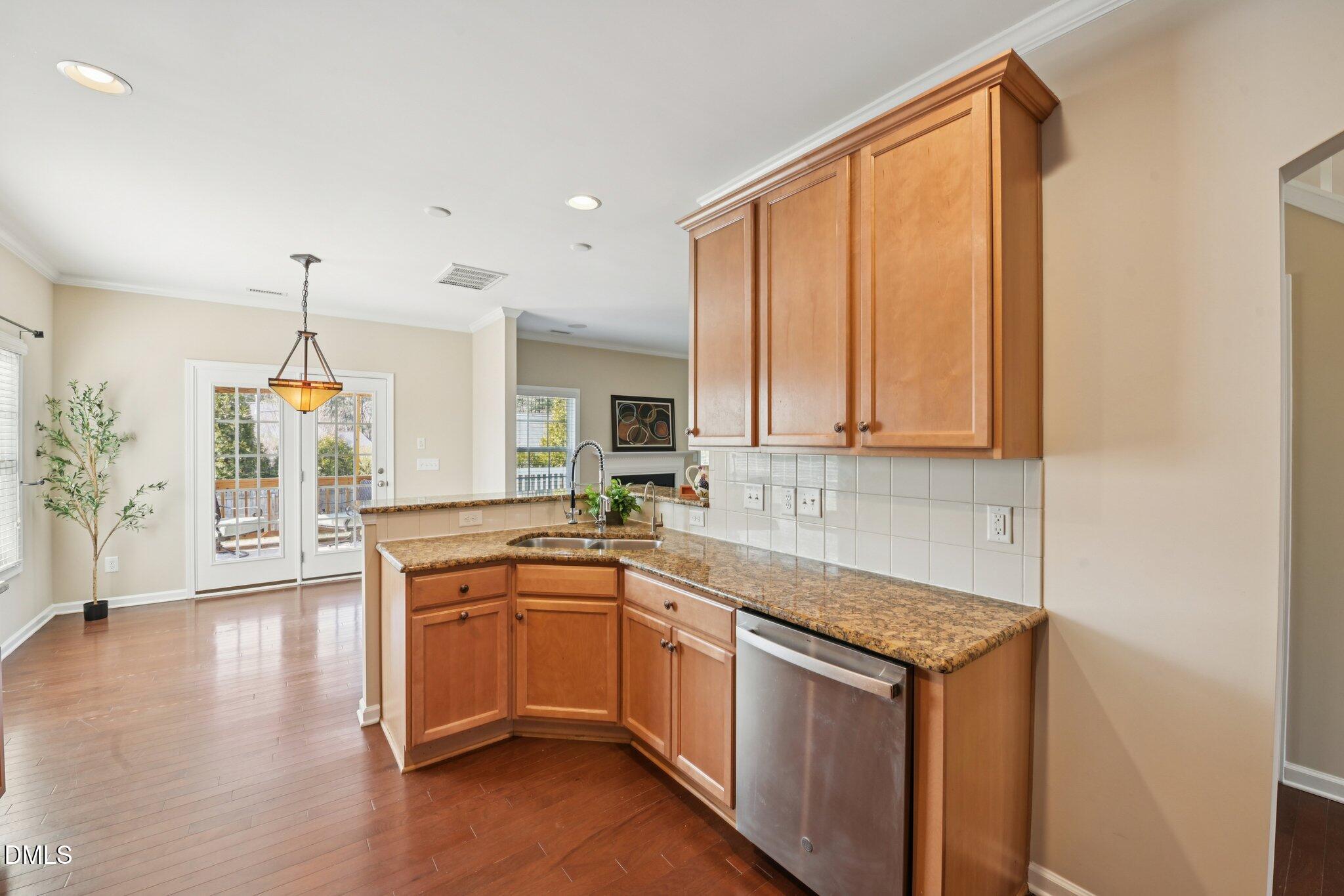 11 Hidden Ridge Court Durham, NC 27707 - Photo 10 of 30 a kitchen with a sink stove and cabinets