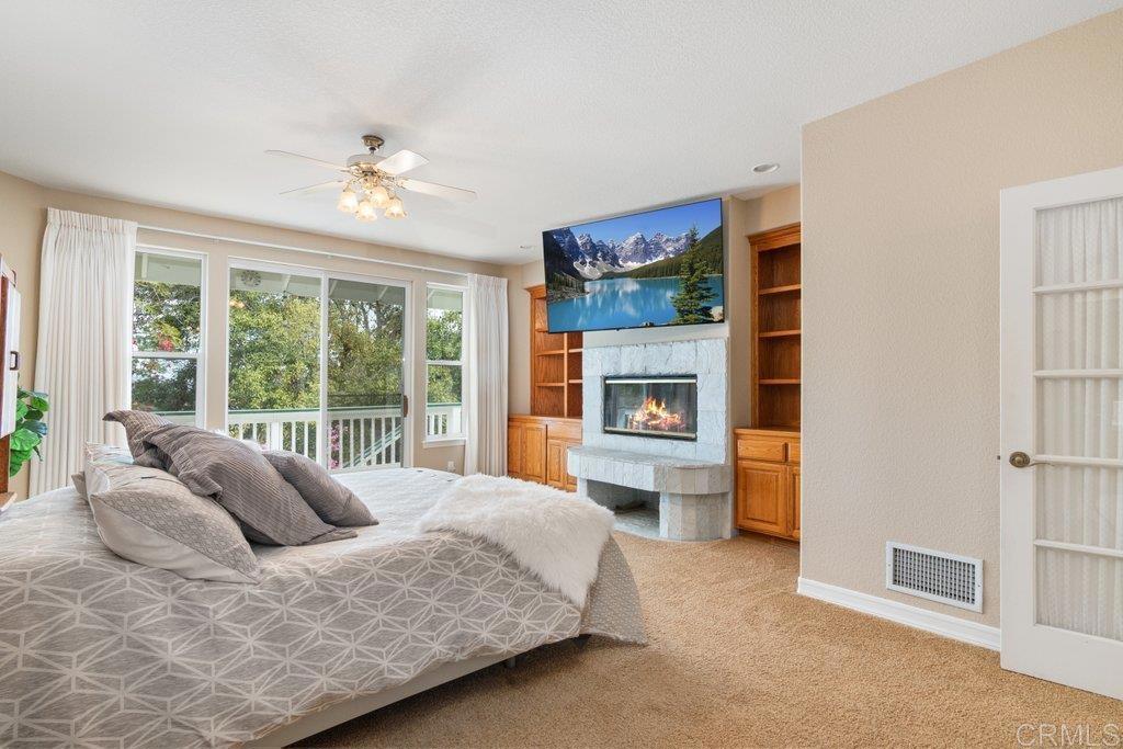 4327 Hollyhill Road Vista, CA 92084 - Photo 16 of 40 Primary Bedroom with Fireplace