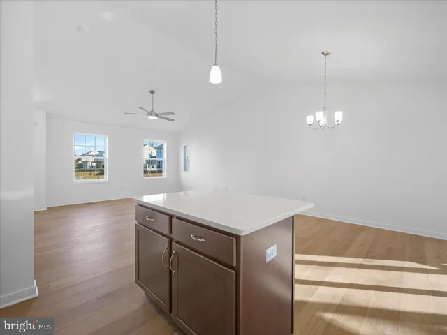 a kitchen with a sink stove and microwave