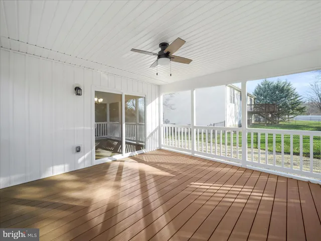 a view of a room with wooden floor and balcony