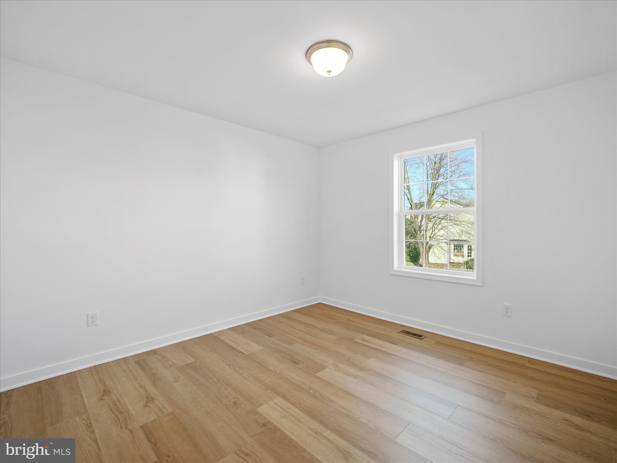 110 Hykes Road East Greencastle, PA 17225 - Photo 24 of 40 an empty room with wooden floor and windows
