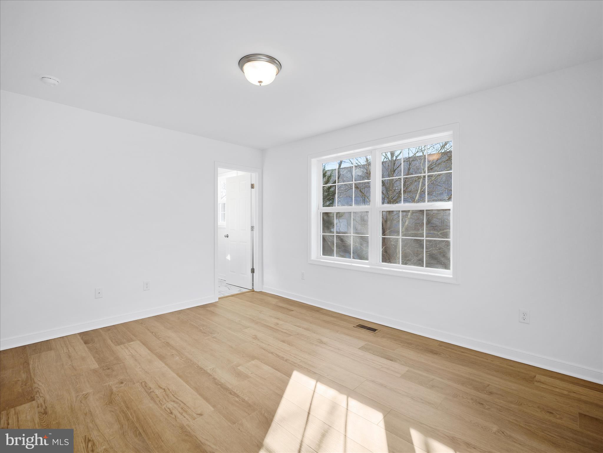 110 Hykes Road East Greencastle, PA 17225 - Photo 27 of 40 an empty room with wooden floor and windows