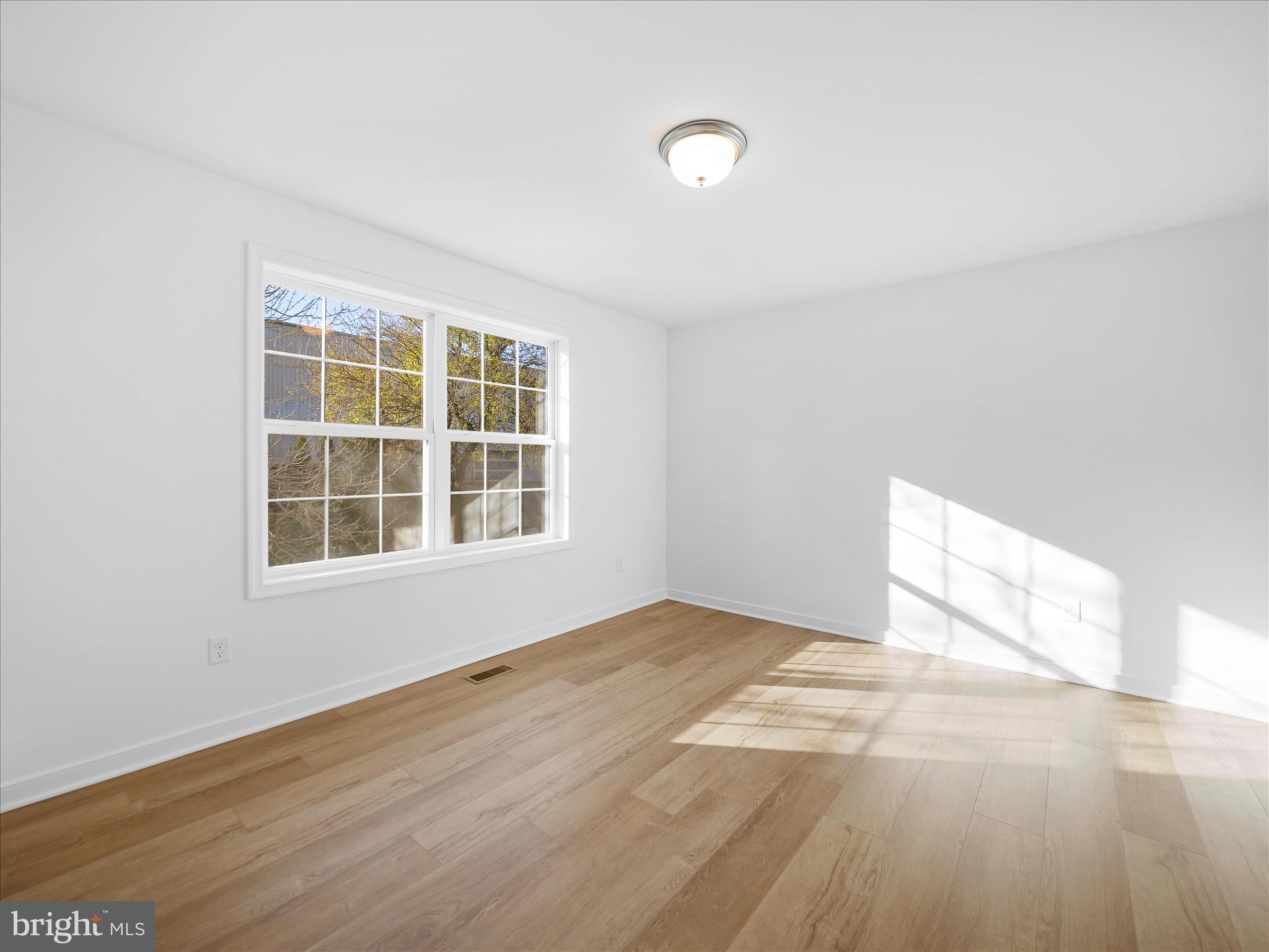 110 Hykes Road East Greencastle, PA 17225 - Photo 29 of 40 an empty room with wooden floor and windows