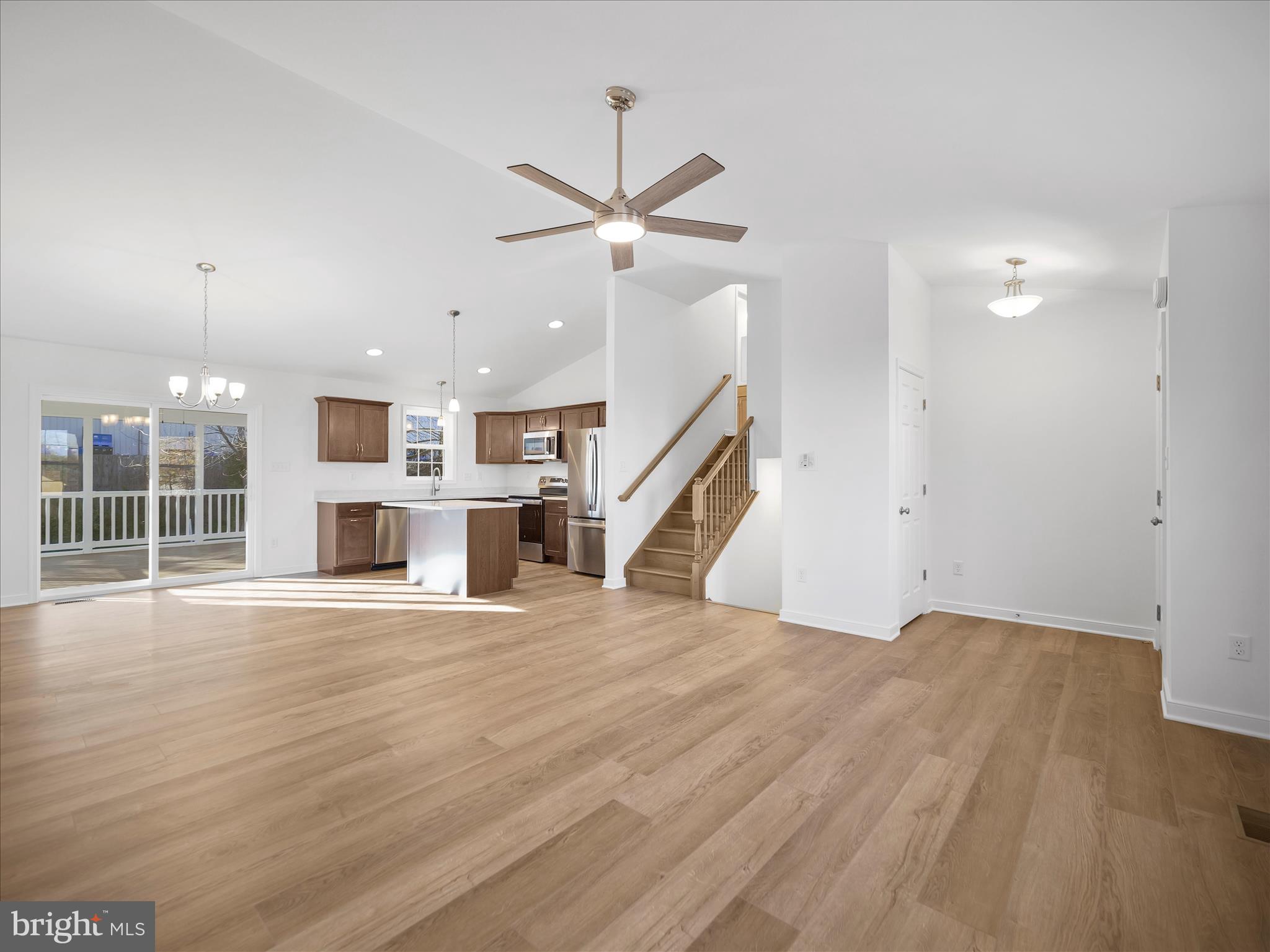 110 Hykes Road East Greencastle, PA 17225 - Photo 40 of 40 a view of an empty room with a window and wooden floor
