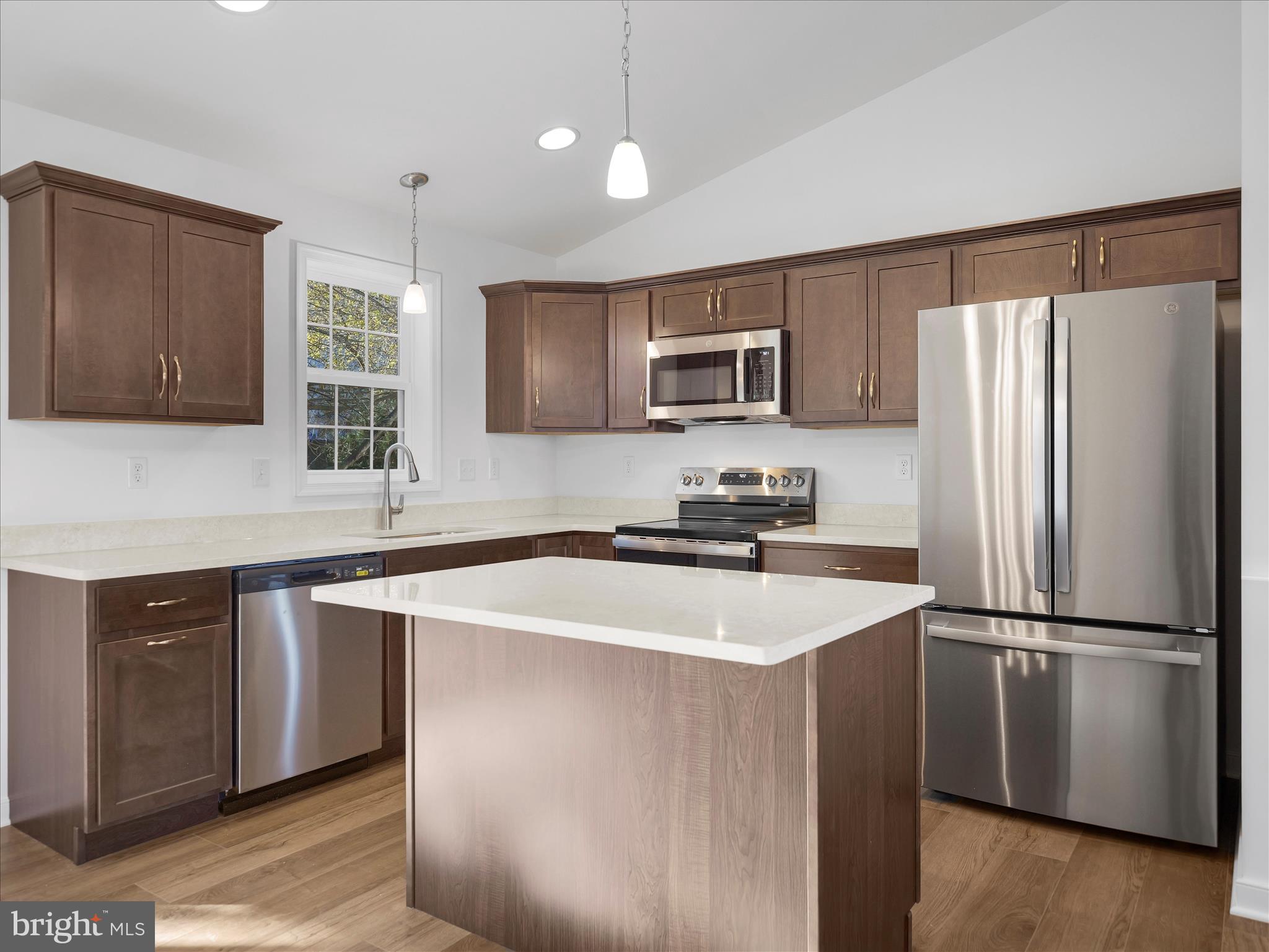 110 Hykes Road East Greencastle, PA 17225 - Photo 9 of 40 a kitchen with kitchen island a sink stainless steel appliances and cabinets