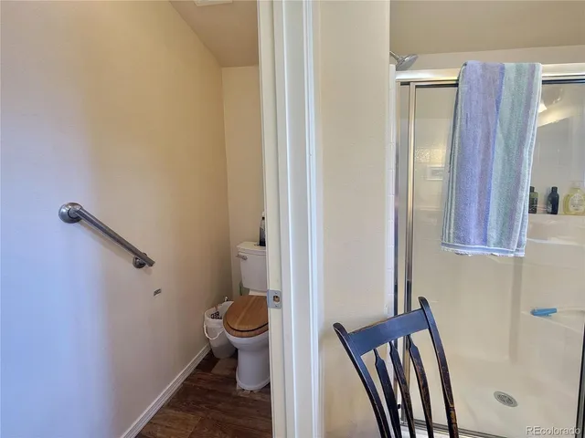 a view of a bathroom from a corridor