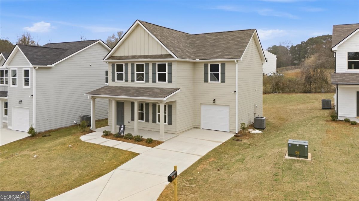 5 Morningside Court Thomaston, GA 30286 - Photo 2 of 26 a front view of house with yard outdoor seating and barbeque in front of it