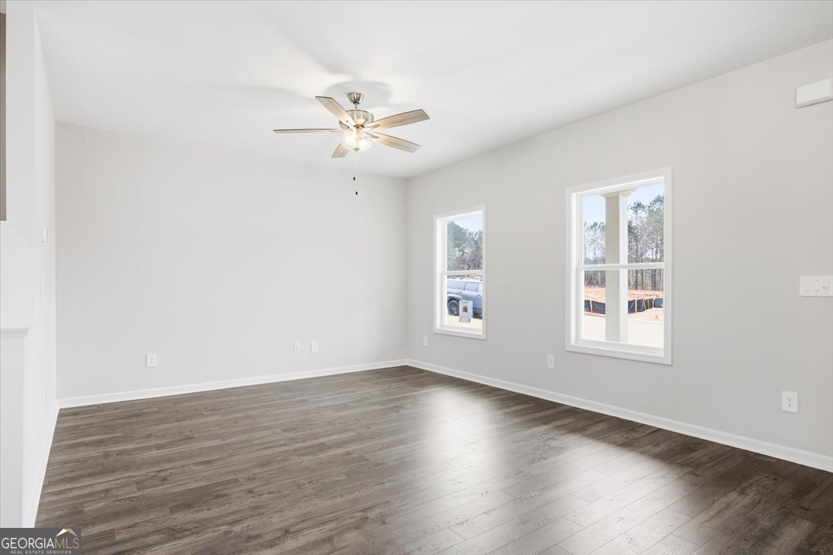 5 Morningside Court Thomaston, GA 30286 - Photo 5 of 26 a view of an empty room with wooden floor and a window