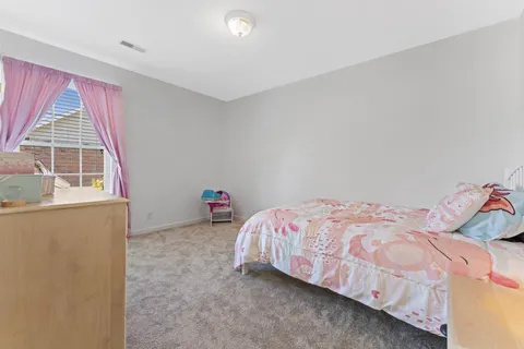 a bedroom with a bed and a closet