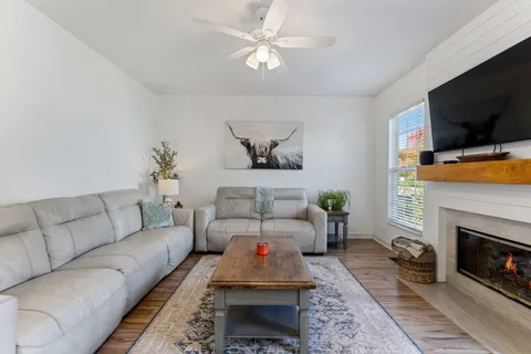 a living room with furniture and a rug