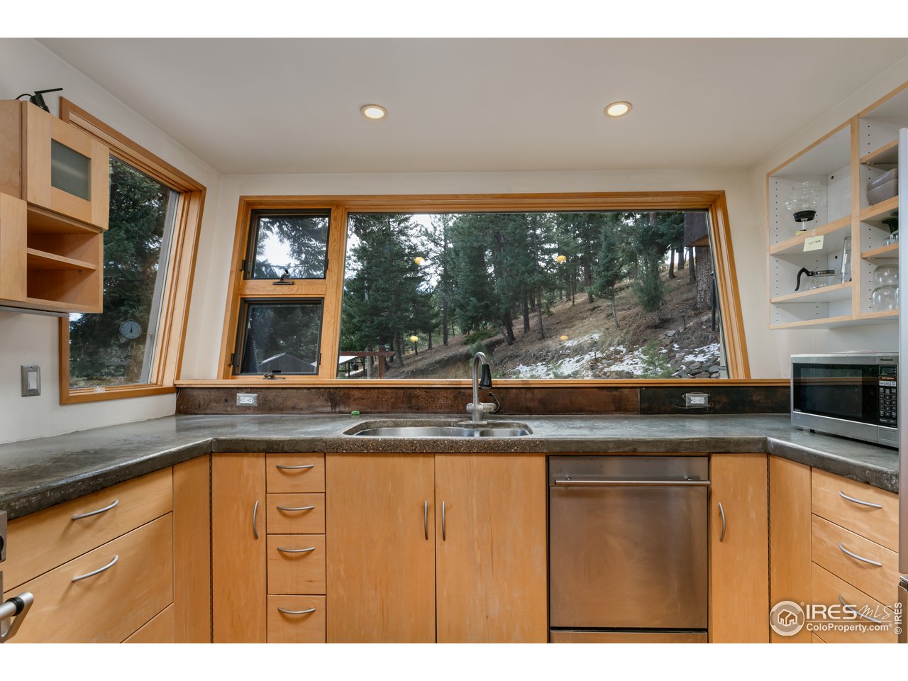12 Dime Road Boulder, CO 80302 - Photo 5 of 28 a kitchen with granite countertop a sink and a large window
