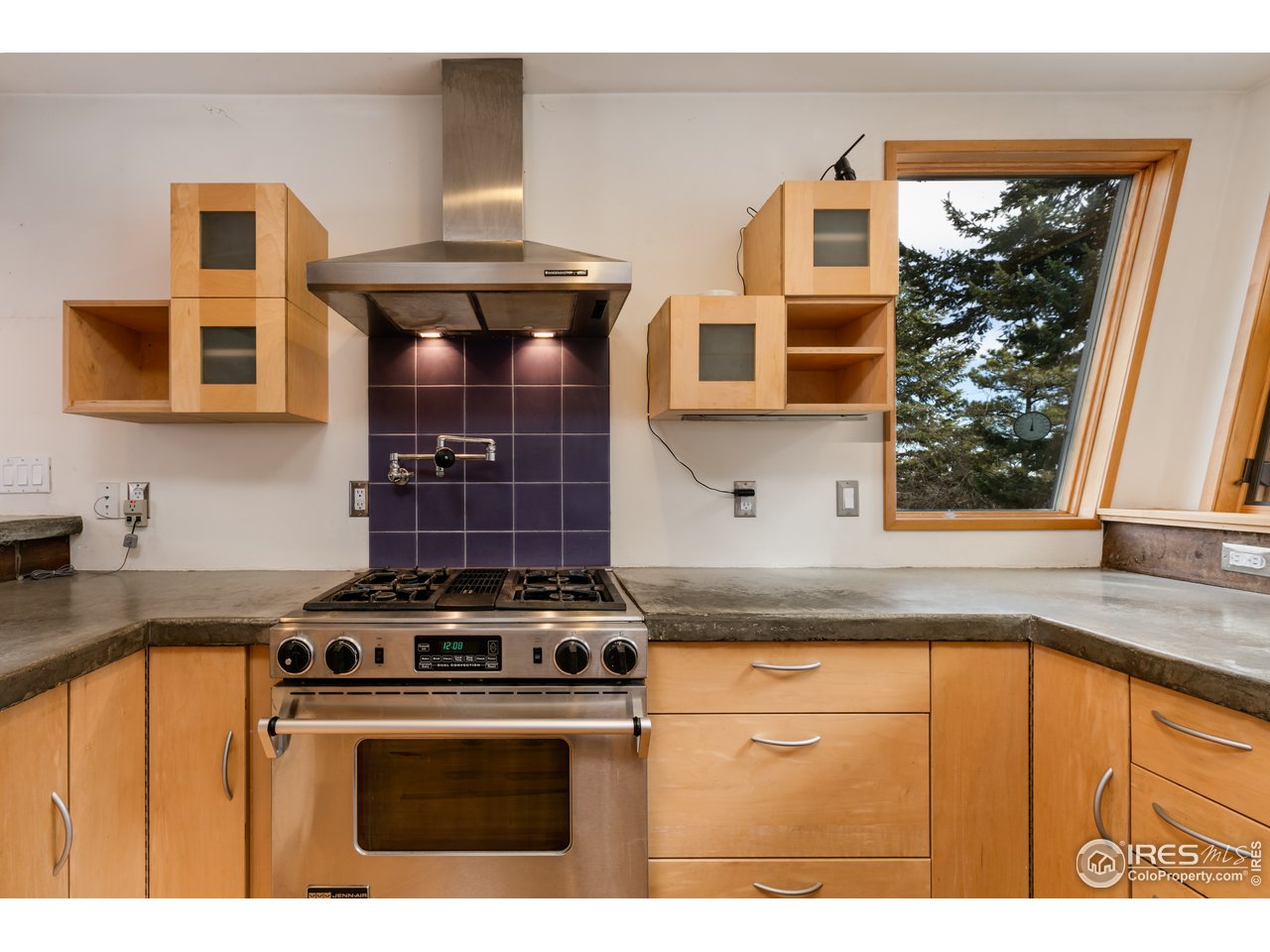 12 Dime Road Boulder, CO 80302 - Photo 6 of 28 a kitchen with granite countertop a stove and a sink