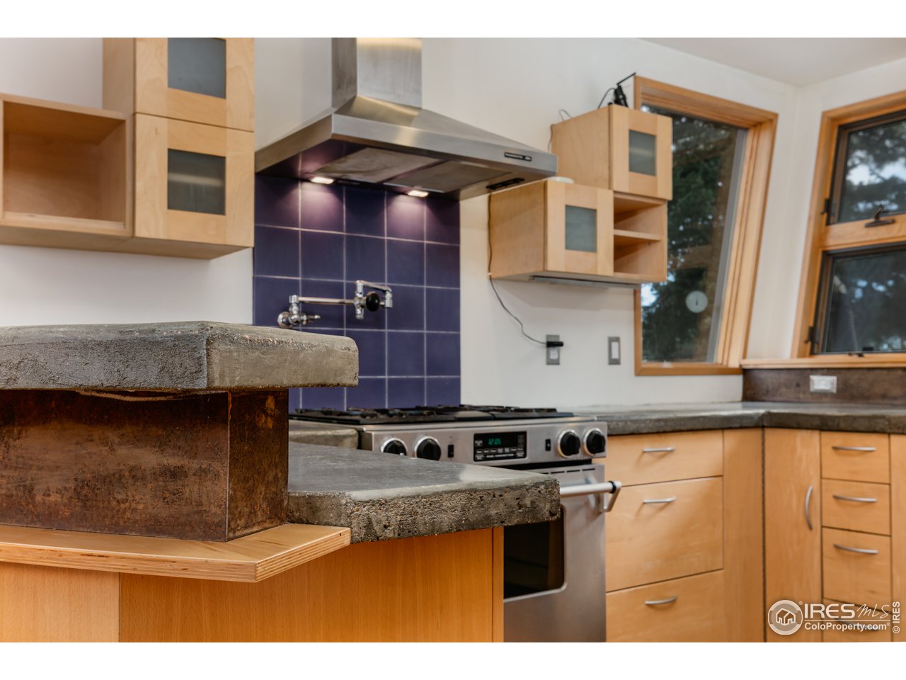 12 Dime Road Boulder, CO 80302 - Photo 8 of 28 a kitchen with stainless steel appliances granite countertop a stove and a sink