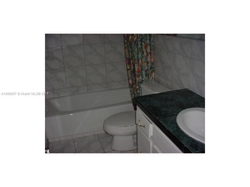 17900 North Bay Road, Unit PH3 Sunny Isles Beach, FL 33160 - Photo 15 of 18 a bathroom with a granite countertop sink a toilet and shower