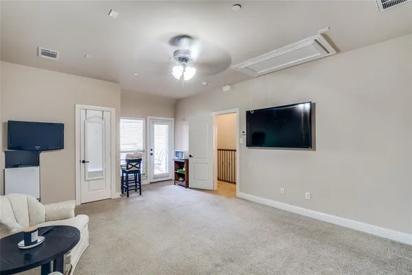 a view of a livingroom with furniture and a flat screen tv