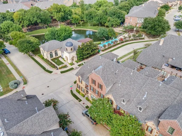 an aerial view of a house with a lake view