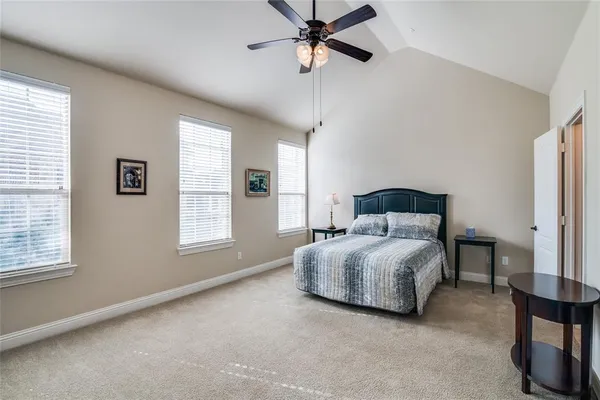 a living room with a bed furniture and a window