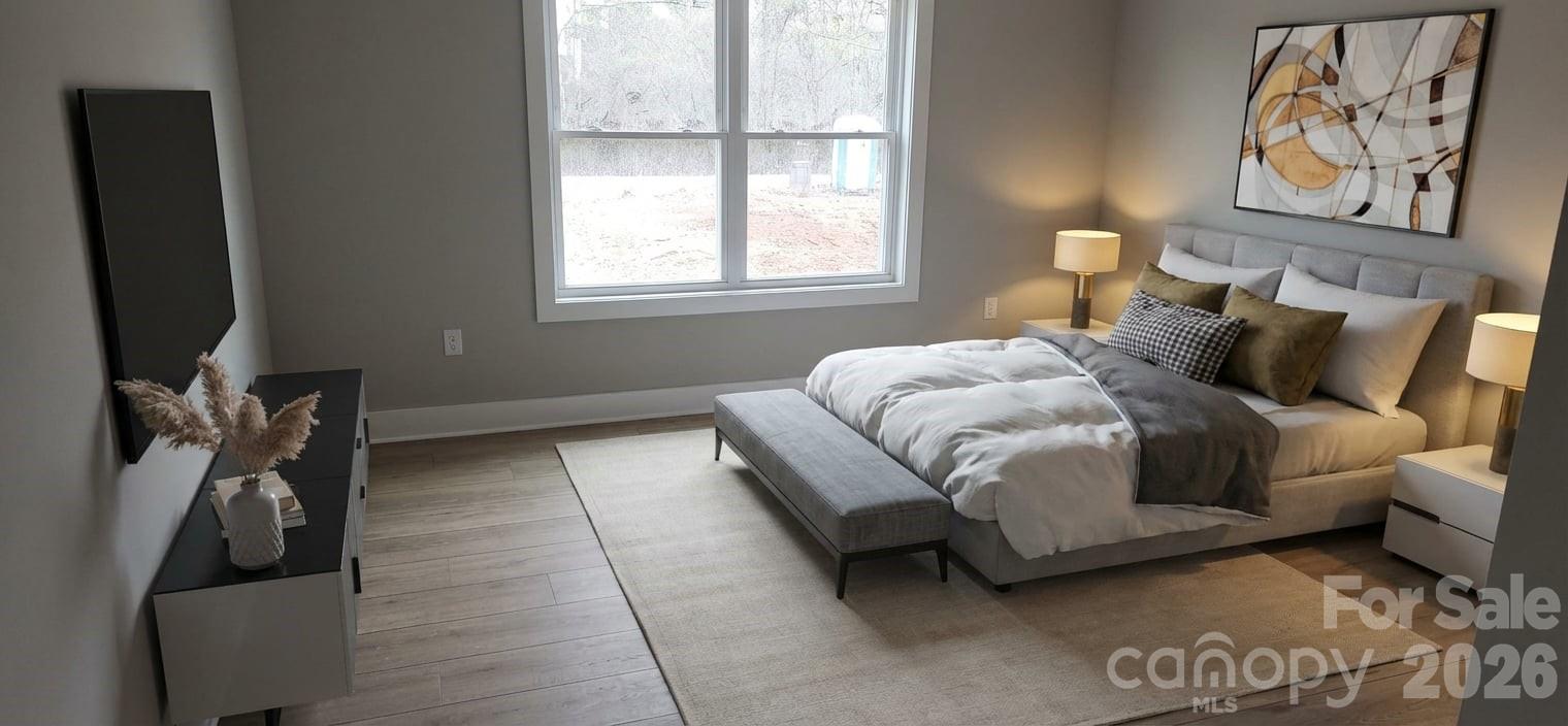 308 Zion Church Road Clover, SC 29710 - Photo 7 of 21 a bedroom with a bed and a flat tv screen on the dresser
