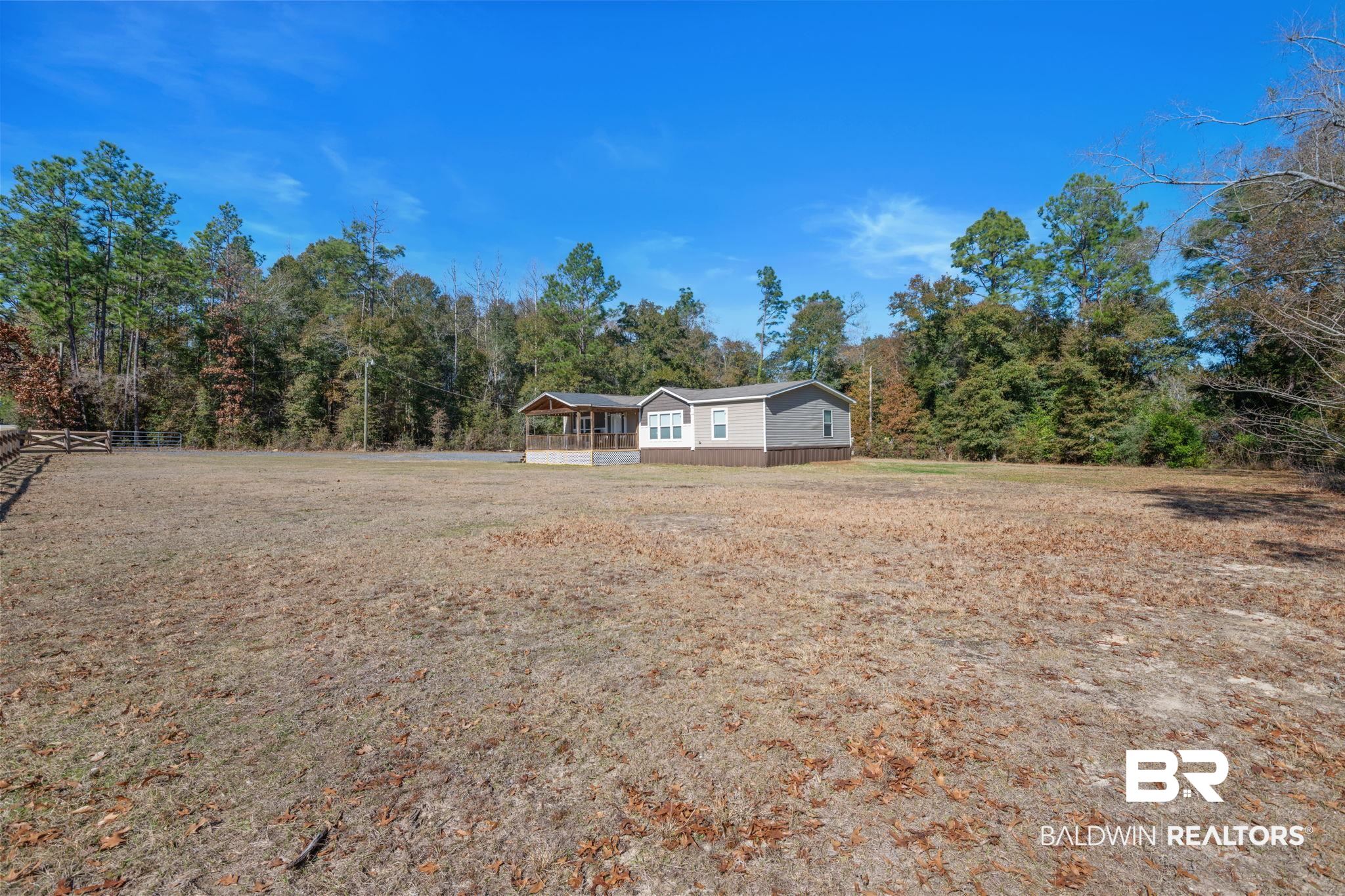 15080 Starlight Avenue Wilmer, AL 36587 - Photo 4 of 29 Exterior space featuring a front yard