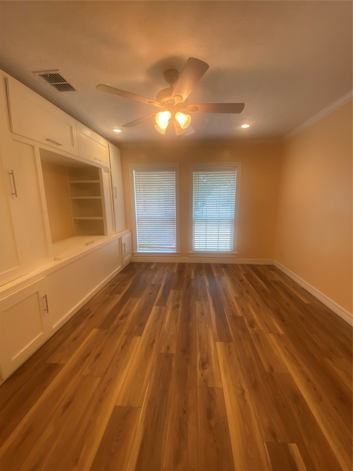 609 Kerr Street Brenham, TX 77833 - Photo 13 of 34 a view of empty room with wooden floor and fan