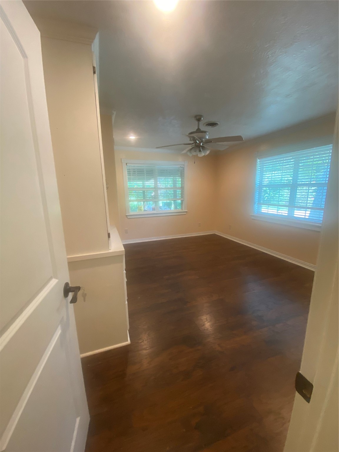 609 Kerr Street Brenham, TX 77833 - Photo 18 of 34 an empty room with windows