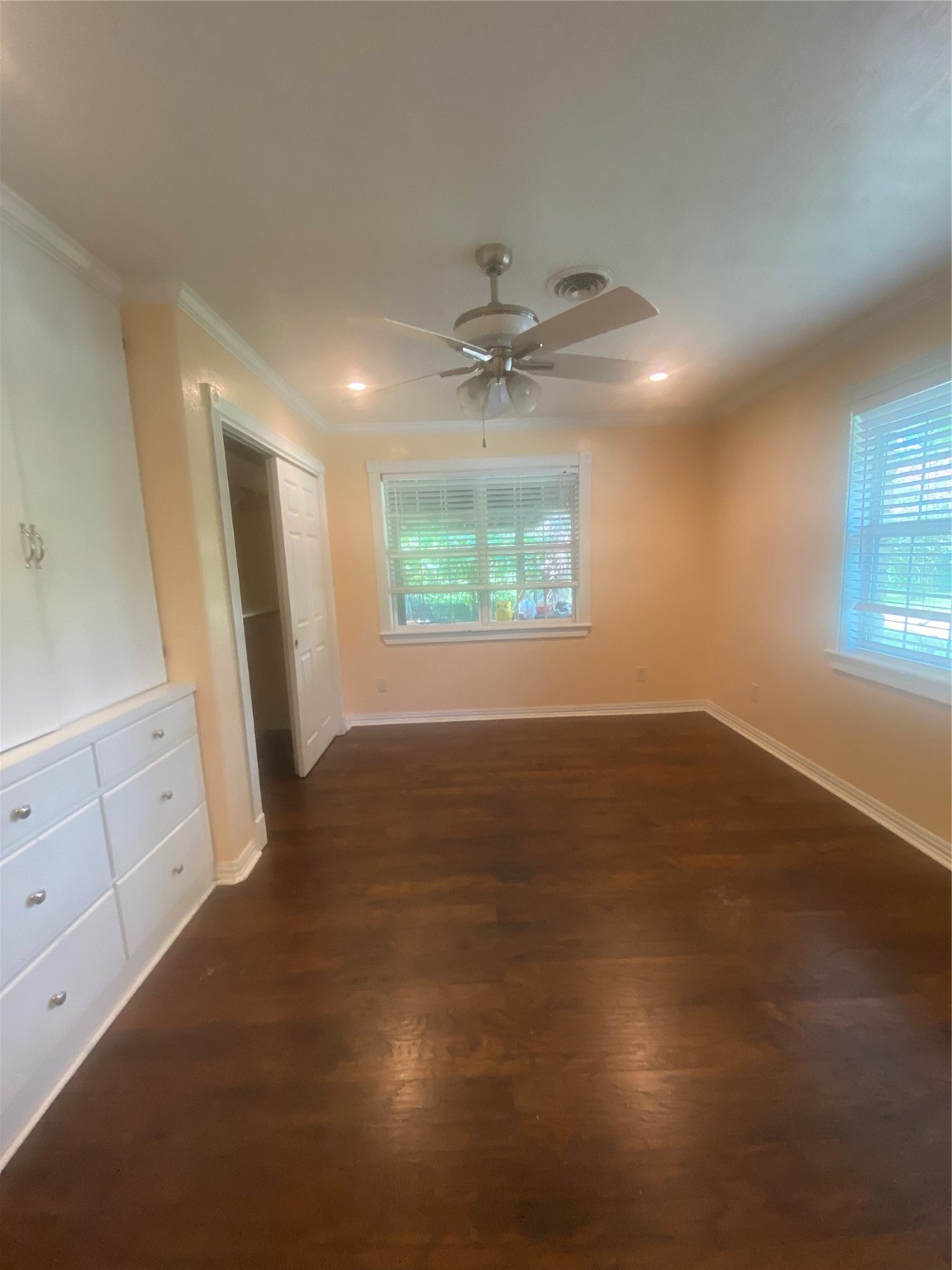 609 Kerr Street Brenham, TX 77833 - Photo 19 of 34 an empty room with windows and fan