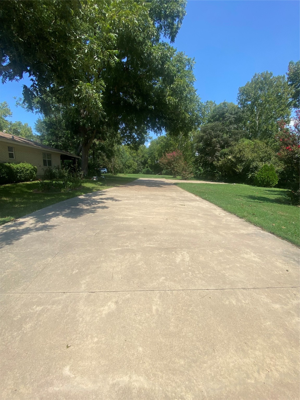 609 Kerr Street Brenham, TX 77833 - Photo 2 of 34 a view of a yard and basketball court