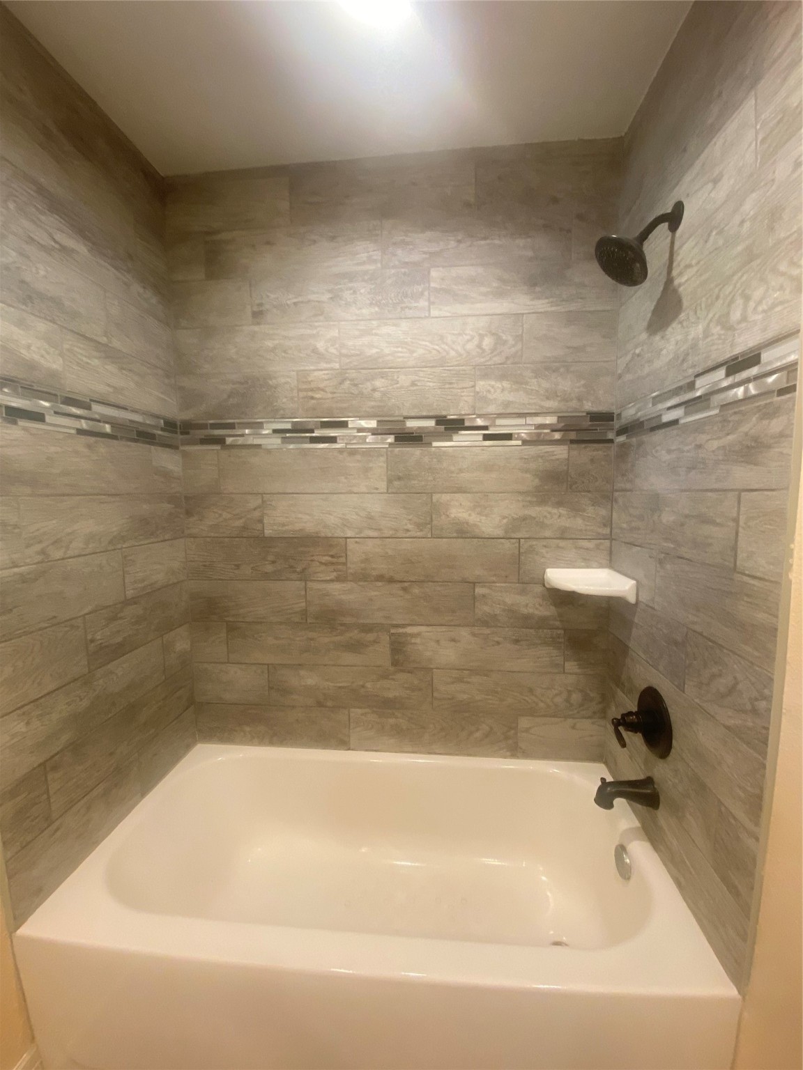 609 Kerr Street Brenham, TX 77833 - Photo 21 of 34 a bathroom with a bathtub