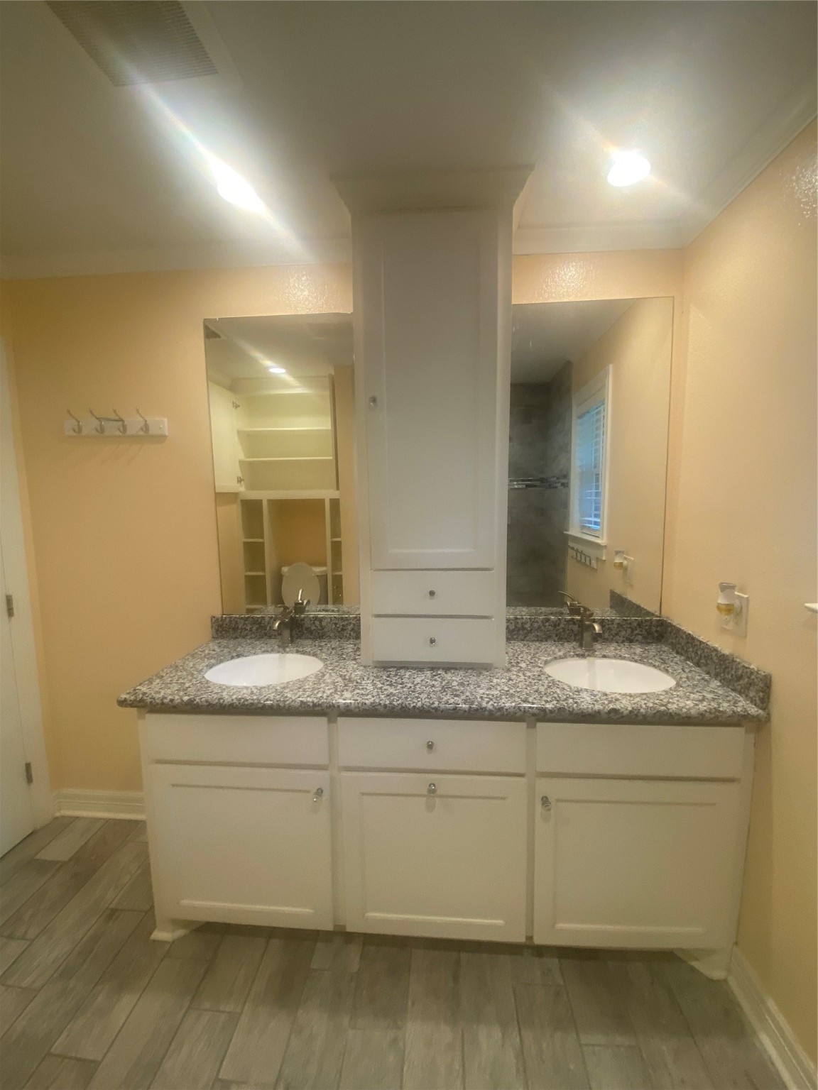 609 Kerr Street Brenham, TX 77833 - Photo 22 of 34 a bathroom with a granite countertop sink and a mirror