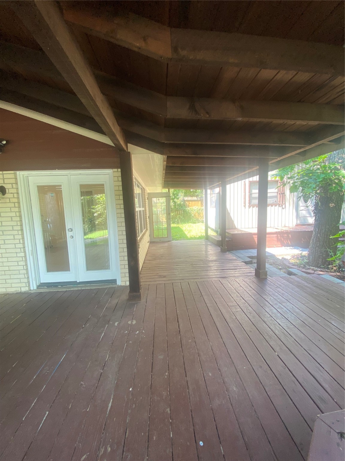 609 Kerr Street Brenham, TX 77833 - Photo 28 of 34 a view of an empty room with wooden floor and a window
