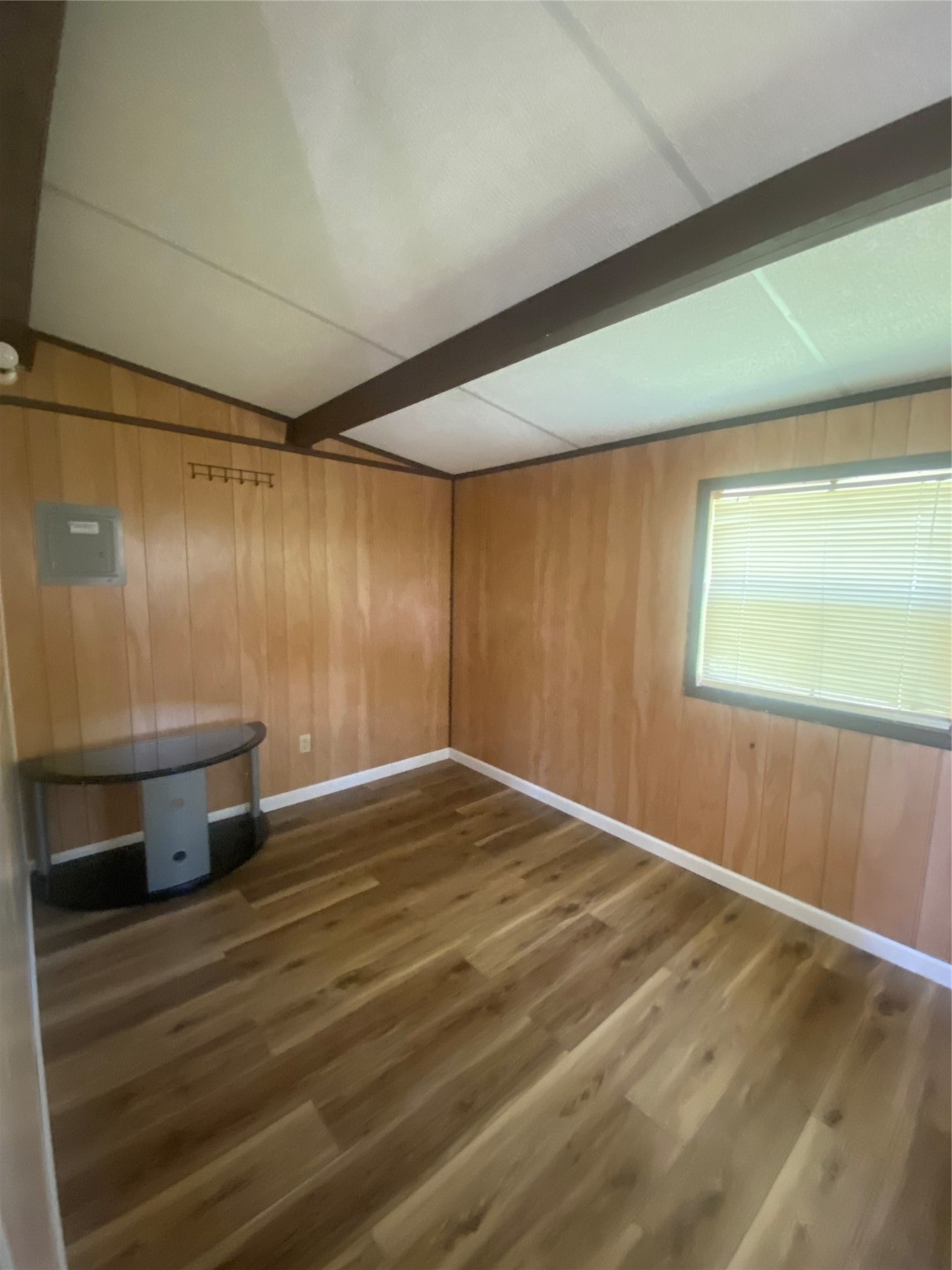 609 Kerr Street Brenham, TX 77833 - Photo 30 of 34 a room with wooden floor and window