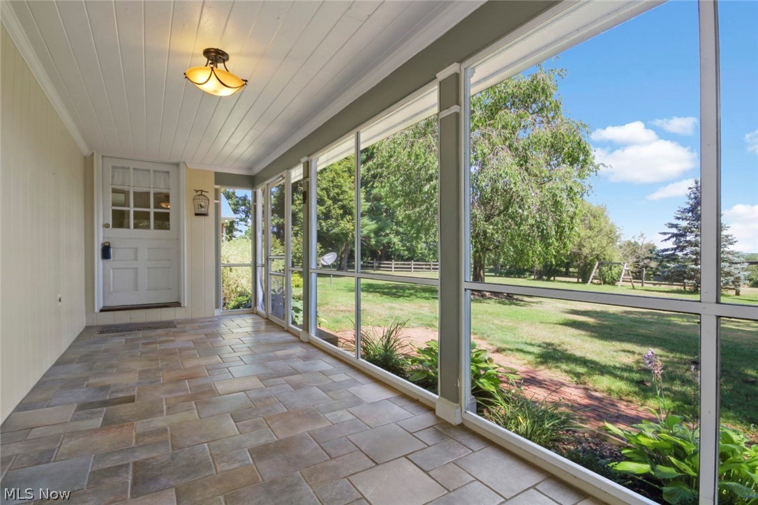 3292 Leffingwell Road Canfield, OH 44406 - Photo 16 of 29 Sun porch with ceramic tile floor