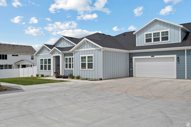 531 North Legend Way West, Unit D Mapleton, UT 84664 - Photo 1 of 42 View of front of house featuring board and batten siding, concrete driveway, a shingled roof, and a garage
