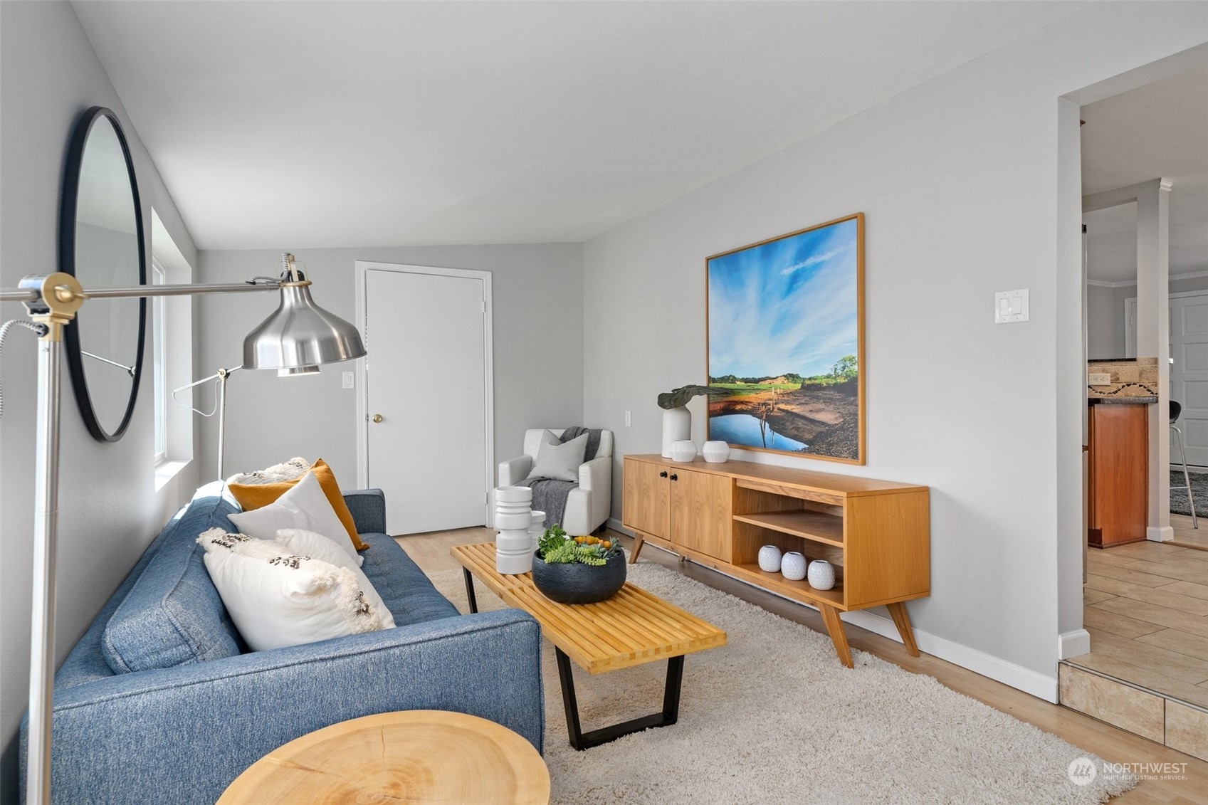 12645 Southeast 170th Street Renton, WA 98058 - Photo 12 of 37 a living room with furniture stairs and a fireplace