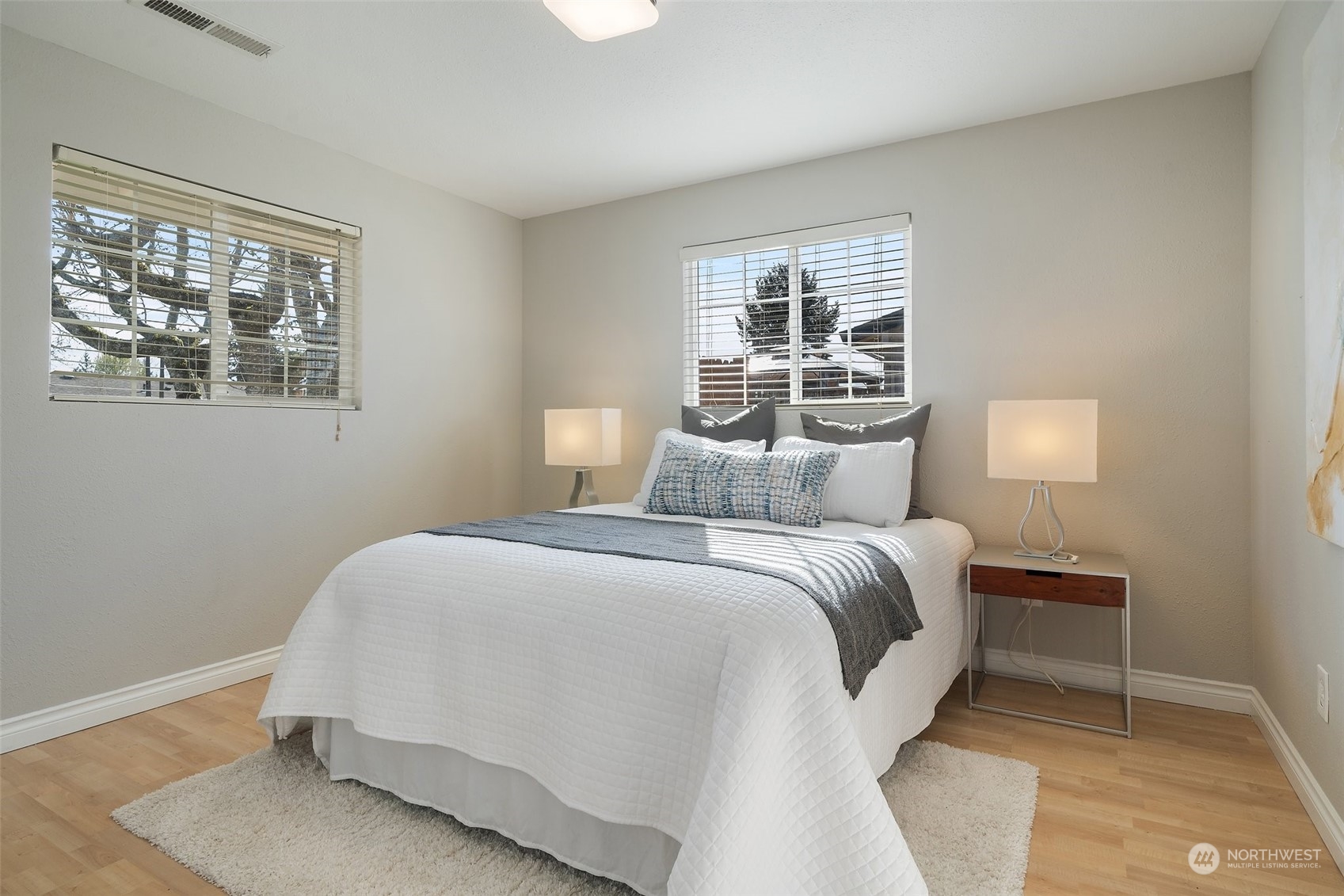 12645 Southeast 170th Street Renton, WA 98058 - Photo 18 of 37 a bedroom with a bed and glass window