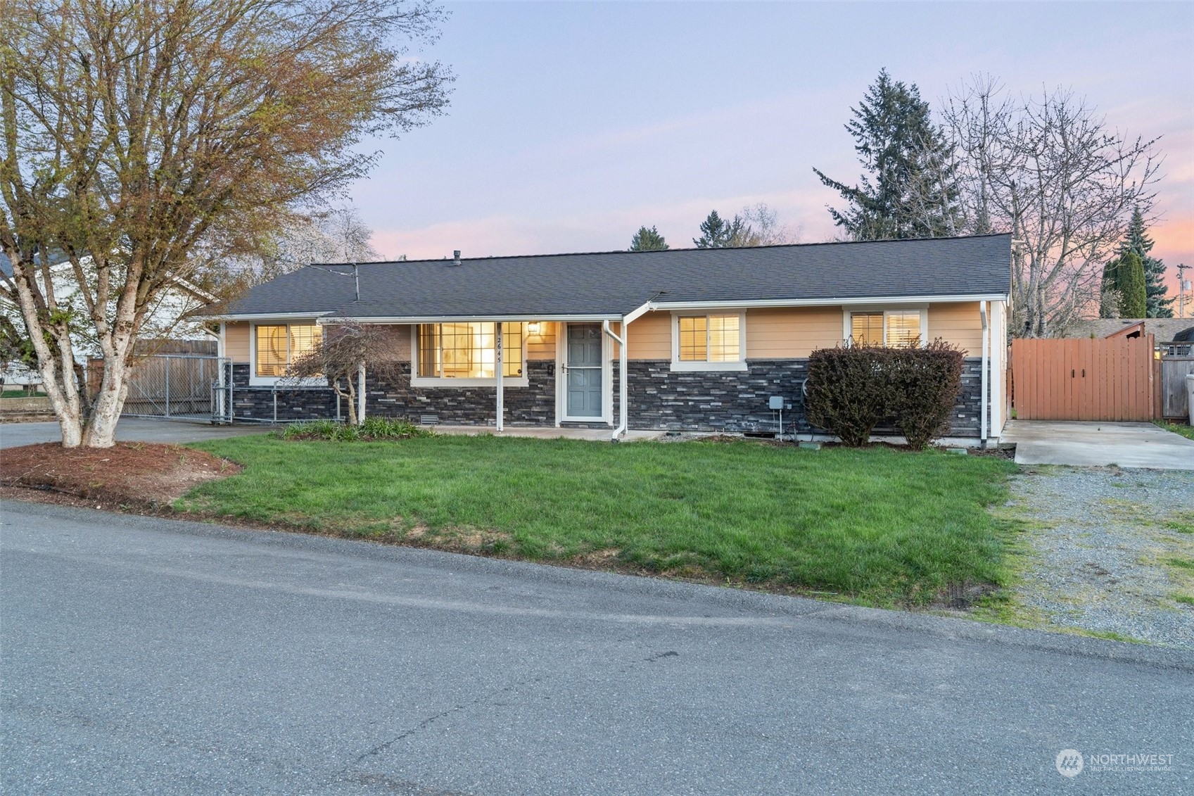 12645 Southeast 170th Street Renton, WA 98058 - Photo 2 of 37 a view of a house with a yard