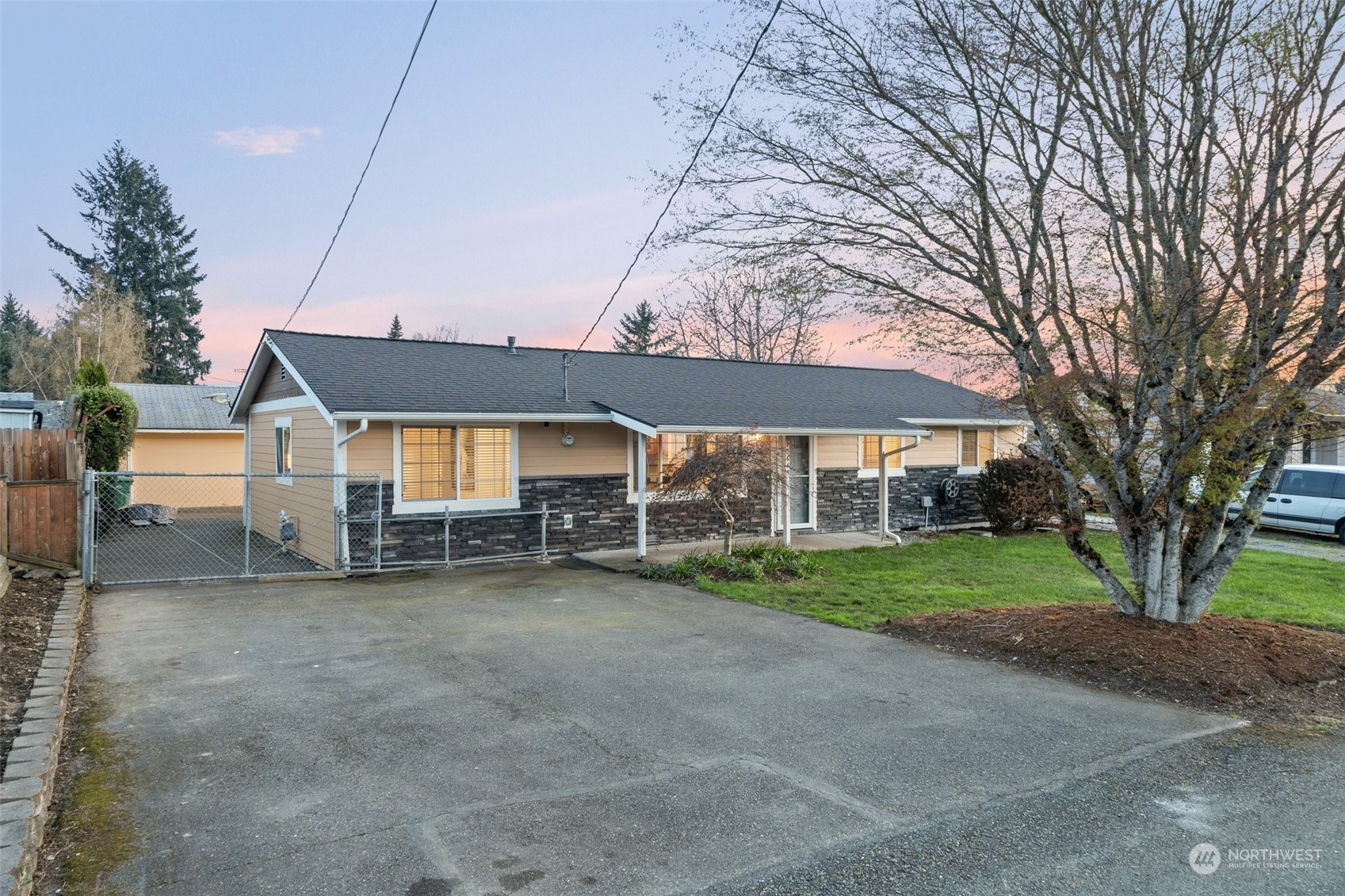 12645 Southeast 170th Street Renton, WA 98058 - Photo 25 of 37 a view of a house with a yard and sitting area