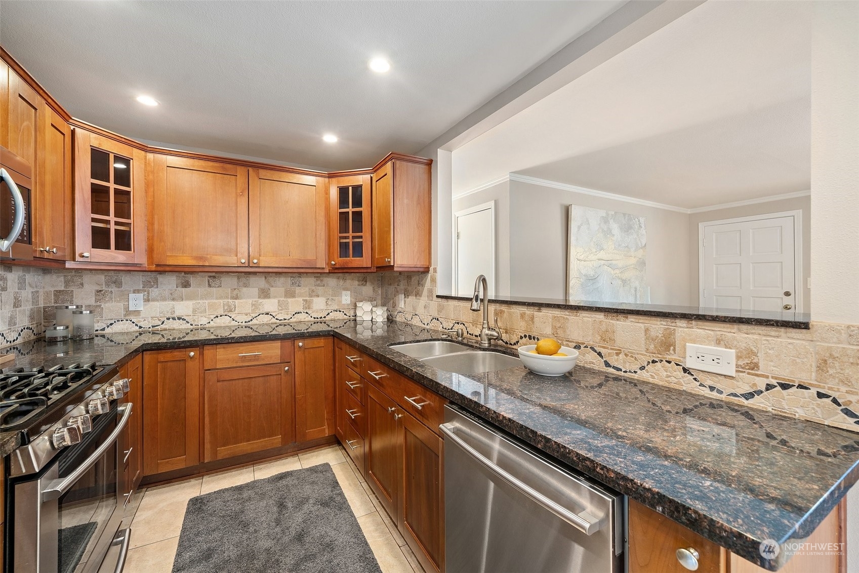 12645 Southeast 170th Street Renton, WA 98058 - Photo 9 of 37 a kitchen that has a sink and a stove in it