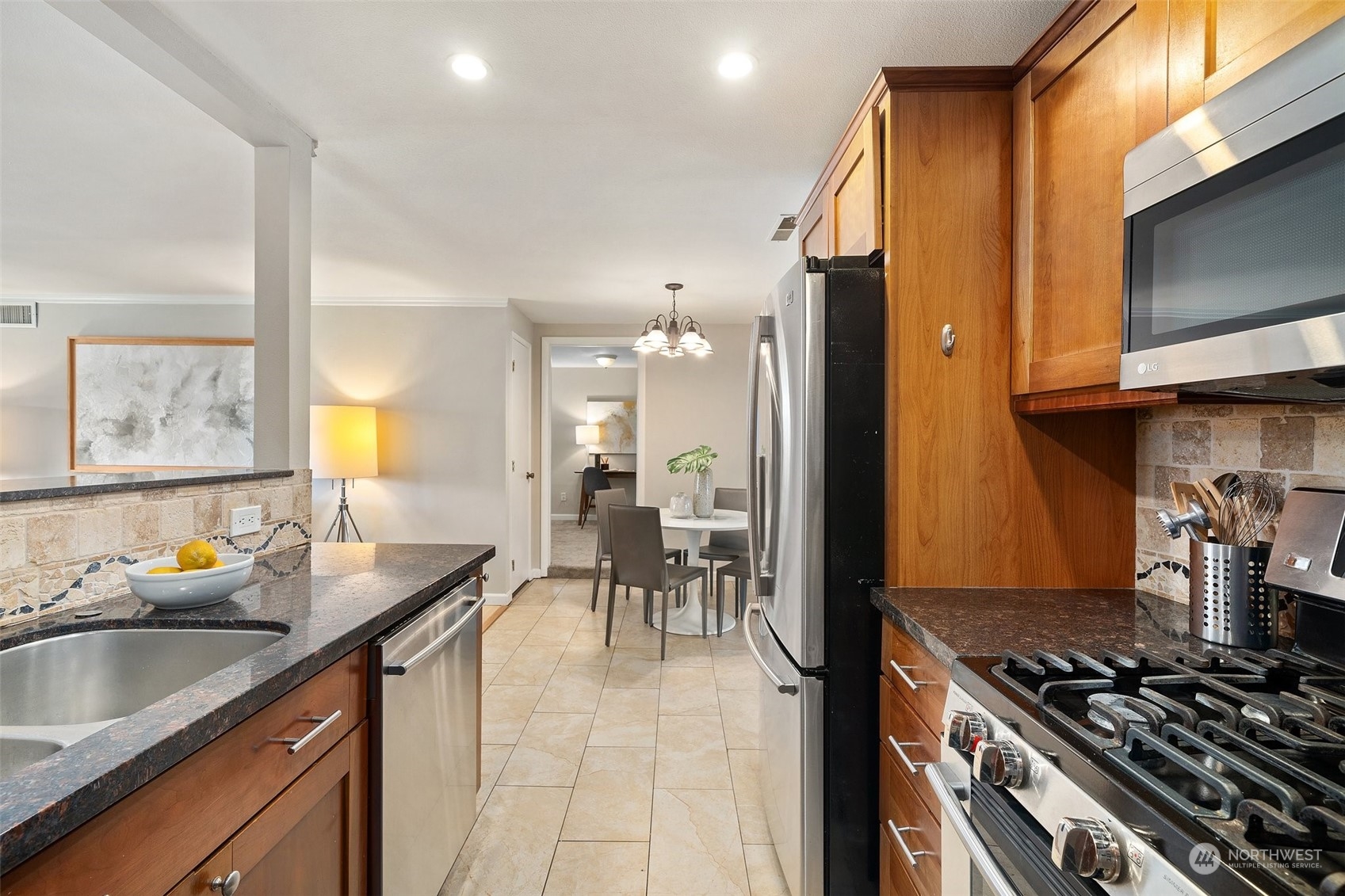 12645 Southeast 170th Street Renton, WA 98058 - Photo 10 of 37 a kitchen with a sink stove and cabinets