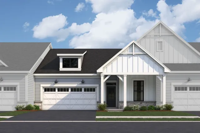 a front view of a house with a garage