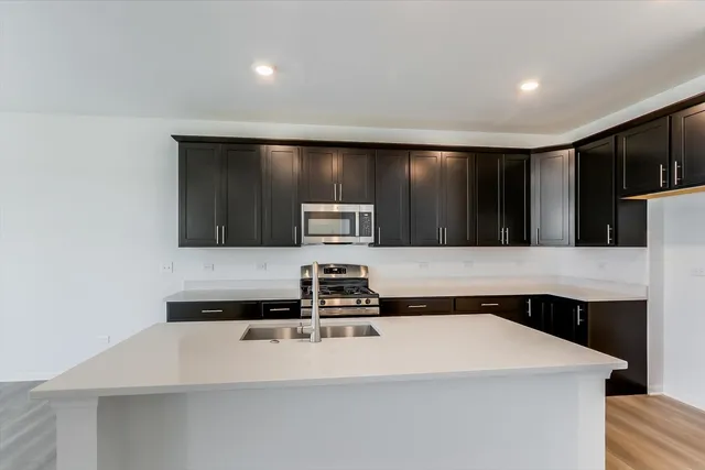 a kitchen with a sink and a refrigerator