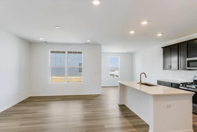 a kitchen with a sink and a window