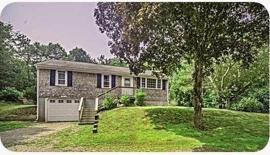 492 Cotuit Road Mashpee, MA 02649 - Photo 1 of 13 a front view of a house with a yard