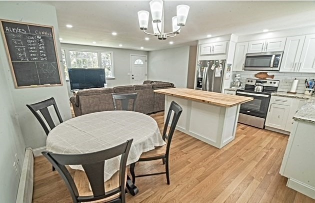 492 Cotuit Road Mashpee, MA 02649 - Photo 4 of 13 a view of kitchen with cabinets table and chairs