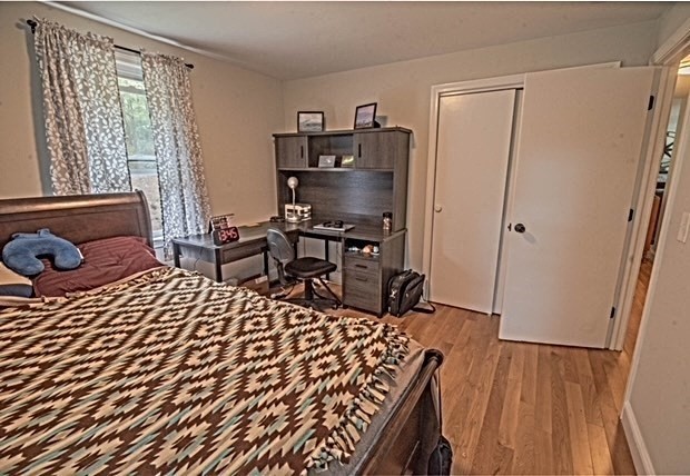 492 Cotuit Road Mashpee, MA 02649 - Photo 6 of 13 a bed room with a bed and a table